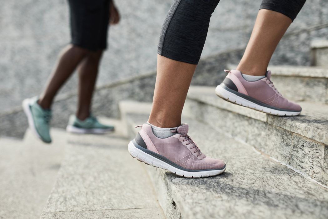 Ground view of sneakers walking up stairs