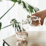 Pouring a clear refreshing glass of water