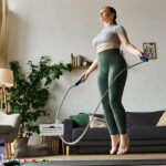 Healthy fit woman jumping rope in a home setting