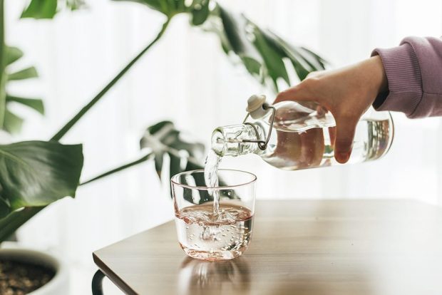 Pouring a clear refreshing glass of water