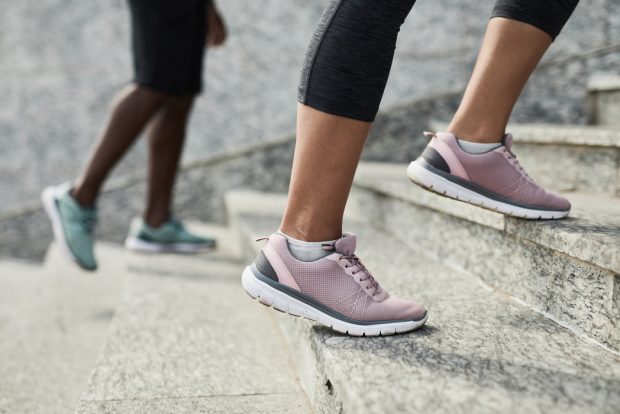 Ground view of sneakers walking up stairs